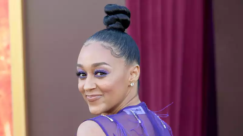 Seeing Tia Mowry's super long braids is part of the vacation.