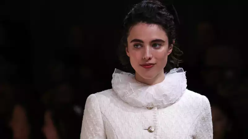 Actress Margaret Qualley makes a surprise appearance on the Chanel Haute Couture runway at Paris Fashion Week